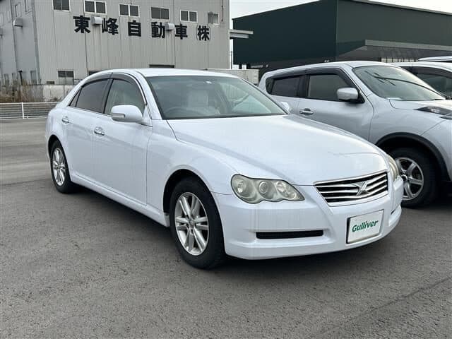 White sedan with sleek design, ideal for city driving and daily commuting.
