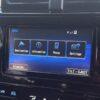 Car dashboard touchscreen with NavigationDisk interface showing menu options.
