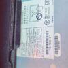 Car audio system with EX10-VO label and wiring components.