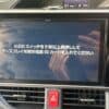 Car navigation system display with instructions in Japanese for SD card setup.