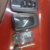 Car key fob with remote control buttons for lock, unlock, and trunk.