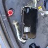 ECM with mounting brackets for automotive diagnostics and electronic control systems.
