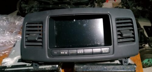 Car multimedia navigation system with touchscreen display and control buttons.