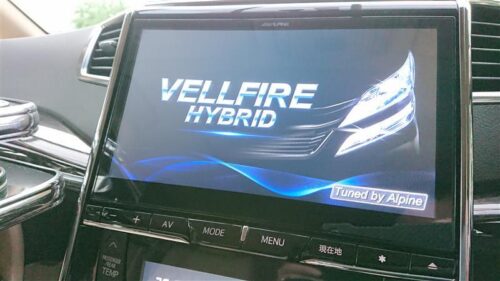 VELLFIRE HYBRID infotainment system display in a car interior.