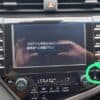 Car navigation system screen displaying program instructions in Japanese with user interface control.