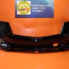 Car front bumper replacement for improved vehicle safety and aesthetics.