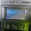 Car multimedia system screen showing source options including DVD, Bluetooth, and SD card.