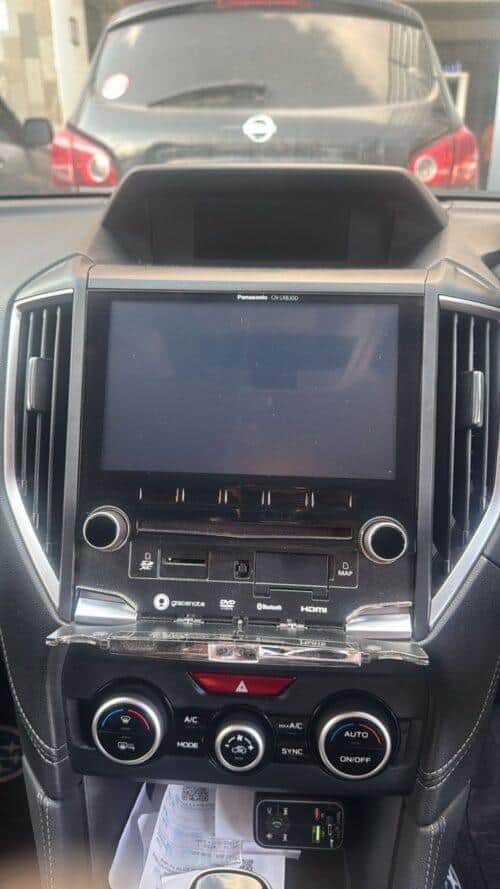 NavigationDisk car infotainment system with touchscreen display in vehicle dashboard.
