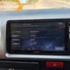 Car security system display showing serial and management numbers.
