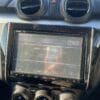 Car dashboard with GPS navigation system and air vents.
