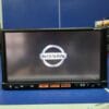 Nissan car multimedia system screen displaying the NavigationDisk interface.