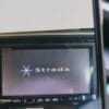 NavigationDisk car navigation system screen displaying "strada" logo and interface.