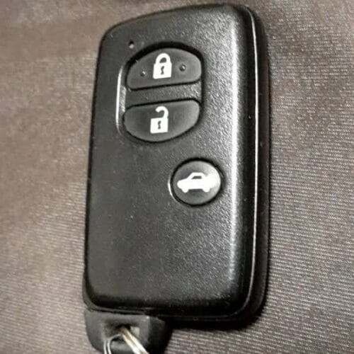 Car key remote fob with lock, unlock, and trunk buttons for vehicle security.
