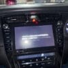 Car multimedia system with touchscreen display and climate controls.