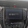 Modern car dashboard with NavigationDisk infotainment system and climate controls.
