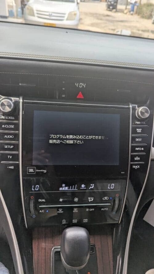 Modern car dashboard with NavigationDisk infotainment system and climate controls.