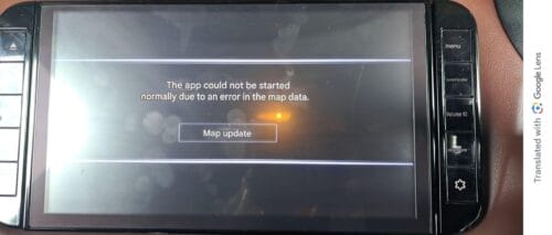 Car GPS navigation system display showing an error message and map update prompt.