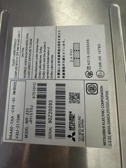 Close-up of Mitsubishi Electric circuit board label with model and serial details.