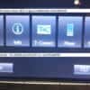 Car multimedia navigation system screen with options for navigation, info, T-Connect, phone, and set.