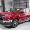 Red Honda SUV displayed at NavigationDisk dealership, showcasing modern design and features.