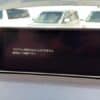 Car dashboard display showing NavigationDisk system with error message.