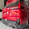 Red SUV rear view showcasing sleek design and modern features.