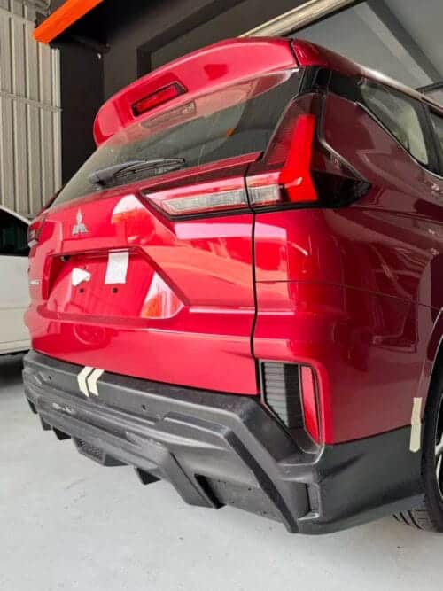 Red SUV rear view showcasing sleek design and modern features.