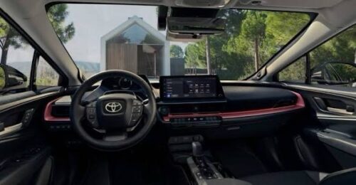 Modern Toyota vehicle interior featuring dashboard, steering wheel, and infotainment screen.
