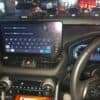 Car navigation system mounted on dashboard with digital map display. Ideal for efficient route plann.
