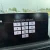 Car navigation system displaying "Enter/CODE ERROR 8" on screen, in a vehicle dashboard.