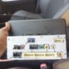 Car audio and navigation system module held inside a vehicle's interior.