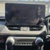 Large car dashboard screen with control buttons and climate settings.