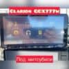Car multimedia system screen showing Clarion GCX777W model features and options.