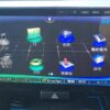 In-car multimedia system touchscreen displaying navigation and entertainment options.