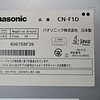 Panasonic CN-F1D car navigation system label with specifications and Japanese text.